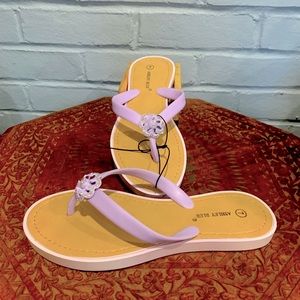 NWT adorable lilac flip flops. Size 7